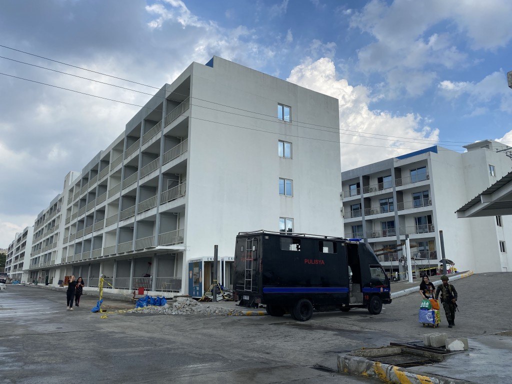 Police conduct investigations at the Clark Sun Valley Hub in Pampanga, Philippines
