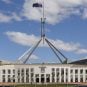 The Australian flag flies on top of the Australian Parliament House