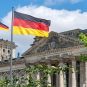 The German Flag of Unity flies in the national colors in front of the Reichstag Building