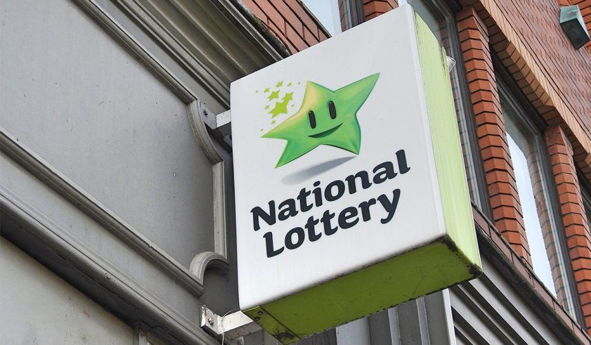A National Lottery sign hangs outside a vendor's store