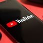 A smartphone with the YouTube logo