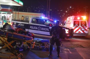 Police and emergency personnel respond to a crime scene in Tijuana, Mexico