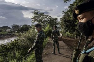 Thai solders conduct a patrol in Mae Sot across the Moei River from Myawaddy, Myanmar