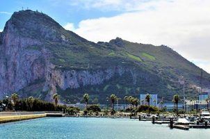 The Rock, better known as Gibraltar, sits in the background of a marina