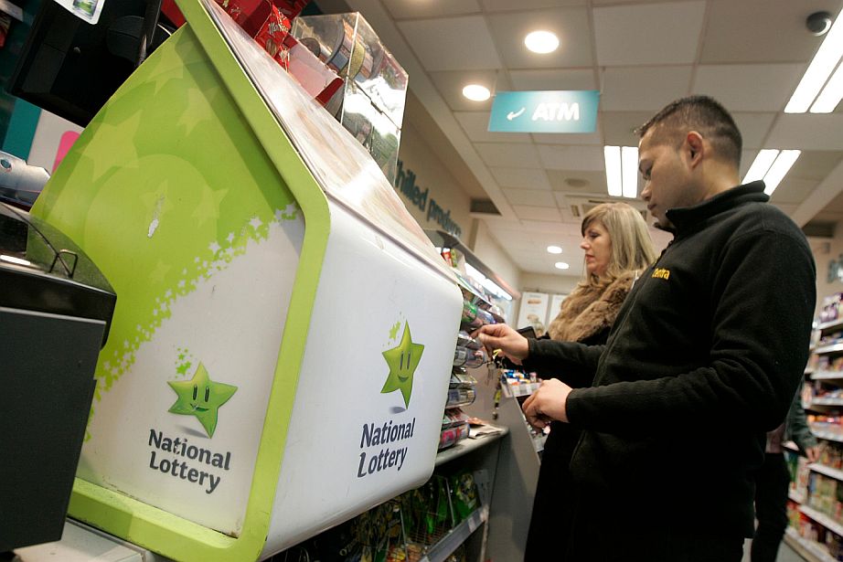 A lottery player browses options with the Irish Lottery