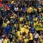 Brazilian soccer fans watch a game in a stadium