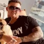 Fernando Pérez Algaba in a social media post with one of his dogs