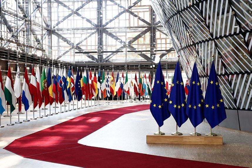 Flags of EU countries fly in the EU headquarters in Brussels, Belgium