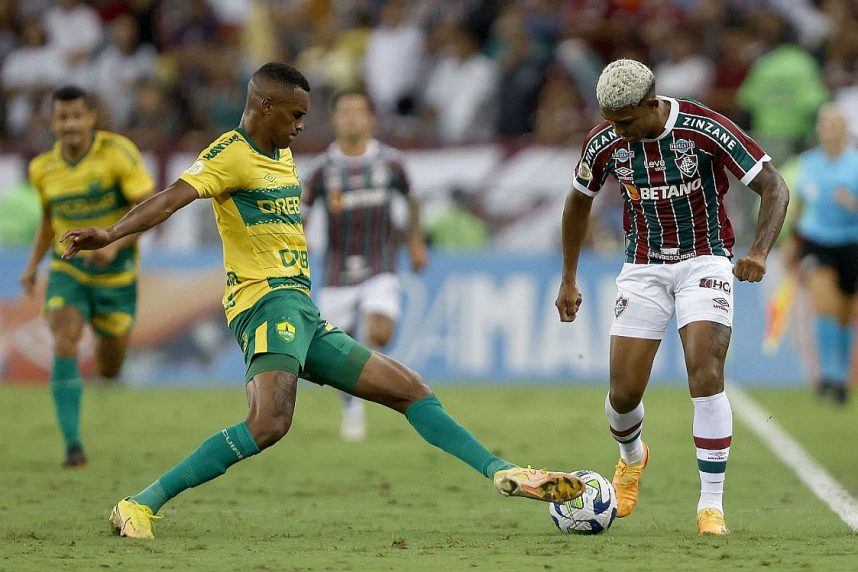 Players from Brazilian soccer teams Cuiaba and Santos battle for the ball