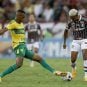 Players from Brazilian soccer teams Cuiaba and Santos battle for the ball