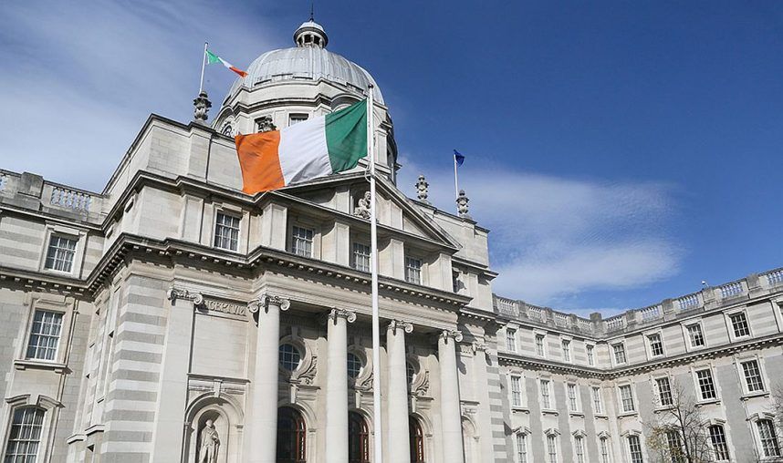 The Irish national flag flies outside the Government Buildings in Dublin