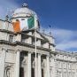 The Irish national flag flies outside the Government Buildings in Dublin