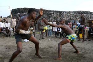 Two fighters participate in the African sport of Dambe