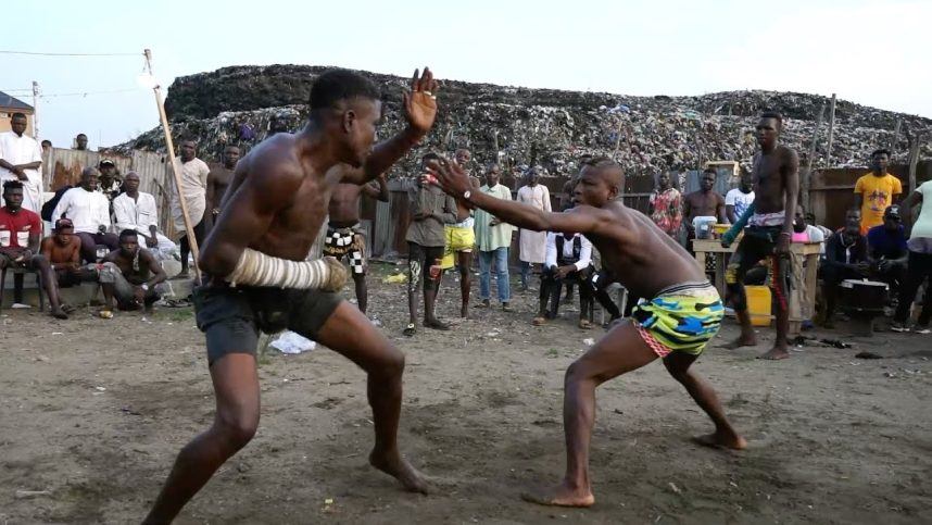 Two fighters participate in the African sport of Dambe