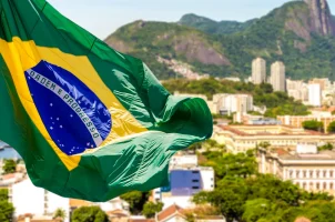 Brazil's national flag waving over Rio de Janeiro