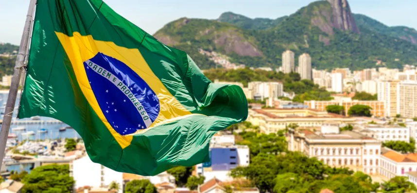 Brazil's national flag waving over Rio de Janeiro