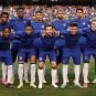 Chelsea FC players pose for a photo with no sponsor on the front of their jerseys