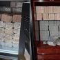 Large stacks of cash found by Singapore police during recent raids