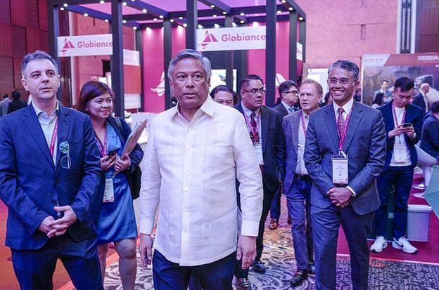 PAGCOR chairman and CEO Alejandro Tengco (center) visits the exhibit area during the opening of the Asean Gaming Summit in Marriott Manila