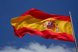 The Spanish flag flying on a pole