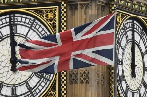 The UK flag flies in front of Big Ben