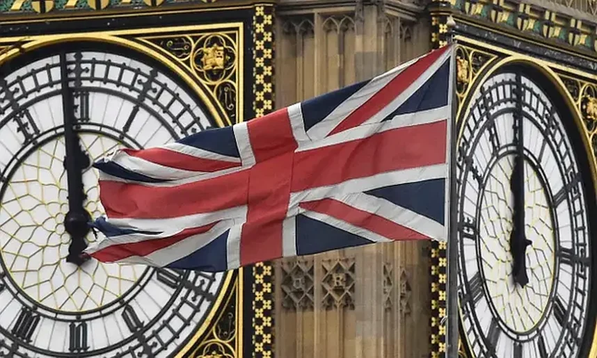 The UK flag flies in front of Big Ben