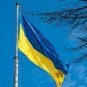 The Ukrainian flag flies on a pole in Lviv