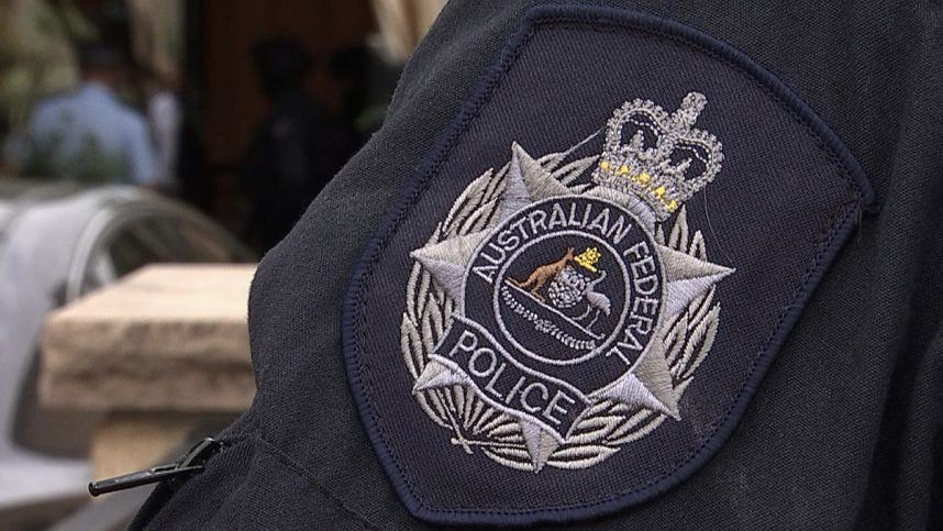 The badge of the Australian Federal Police on an officer's uniform