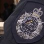 The badge of the Australian Federal Police on an officer's uniform