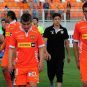 The players of Chile's Cobreloa club head to the locker room with their heads down after a game