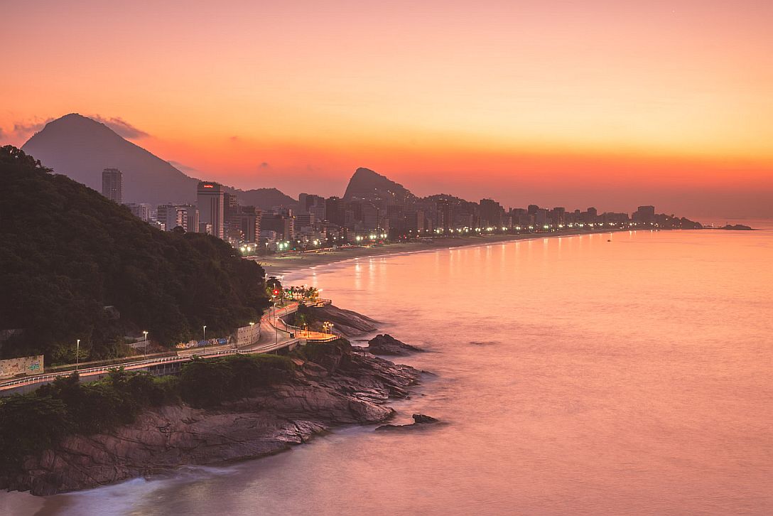 The sun sets behind Rio de Janeiro, Brazil