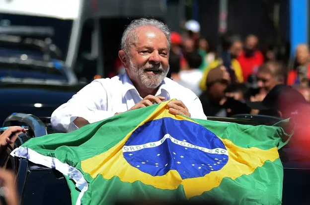 Brazil President Luiz Inacio da Silva holding a Brazilian flag