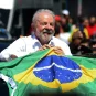 Brazil President Luiz Inacio da Silva holding a Brazilian flag
