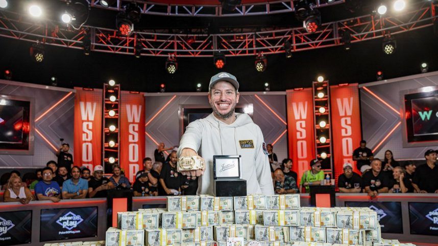 Daniel Weinman shows off his winnings from the 2023 WSOP Main Event