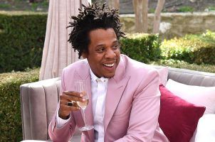 Music mogul and entrepreneur Jay-Z sips champagne