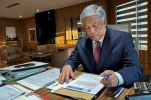 Philippine Amusement and Gaming Corp. Chairman Alejandro Tengco at his desk