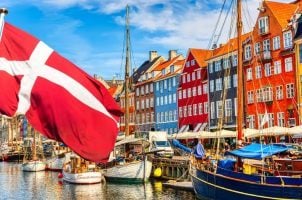 The Danish flag flying from a boat on the water