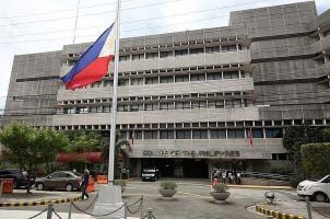 The Philippine flag flying in front the Senate building