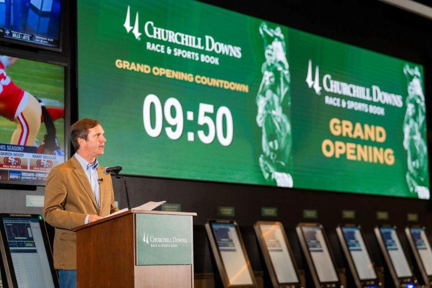 Kentucky Gov. Andy Beshear delivers remarks at Churchill Downs prior to placing the first legal sports bet in the state Sept. 7. The governor has made legal sports betting a key plank in his re-election campaign this year.