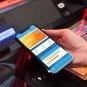 A player prepares to use a cashless gaming app on a gaming machine