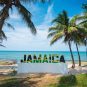 A sign of Jamaica on a beach