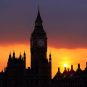 Big Ben stands in front of a fading sun