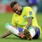 Brazilian soccer player Neymar down on the field with an injury