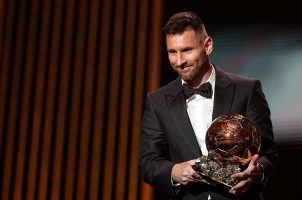 Leo Messi accepting a Ballon d'Or award