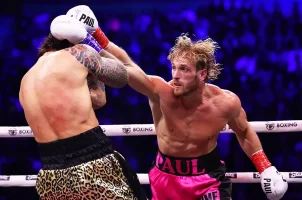Logan Paul gives a glancing blow to the head of Dillon Danis in their boxing match
