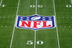 The NFL logo on a football field