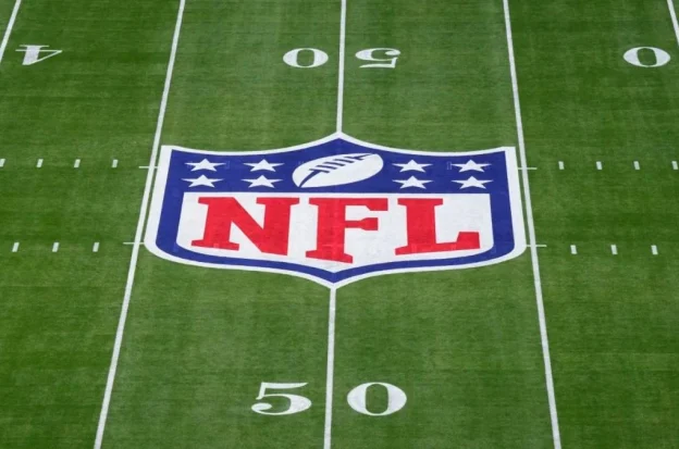 The NFL logo on a football field