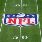 The NFL logo on a football field