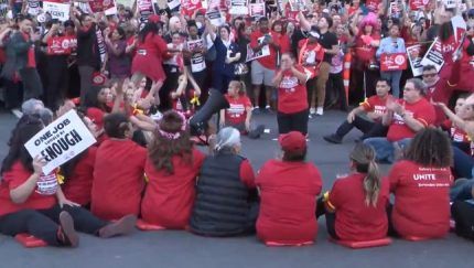 Culinary Union members sit down on the Las Vegas Strip