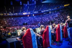 eSports players participate in a live competition in front of an audience
